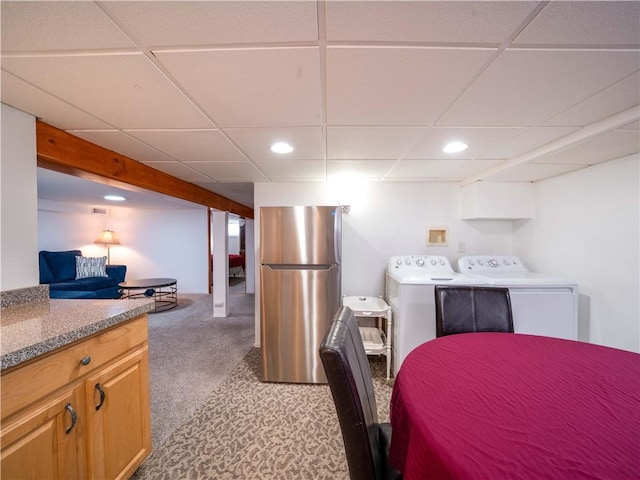 kitchen with washer / dryer, freestanding refrigerator, carpet floors, and recessed lighting