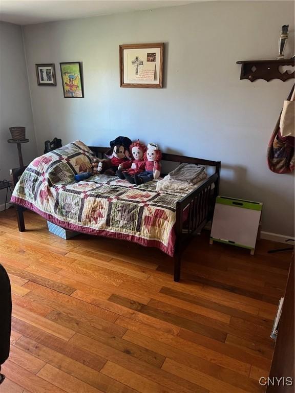330 Hacadam Rd, Frankfort, NY 13456 - bedroom featuring wood-type flooring and baseboards