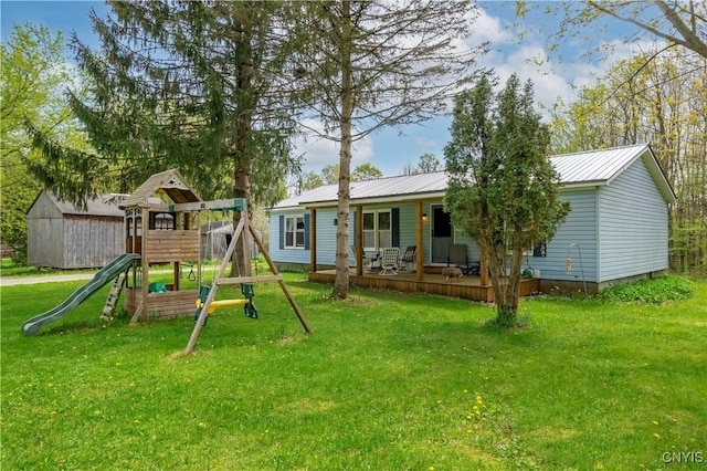 330 Hacadam Rd, Frankfort, NY 13456 - rear view of house featuring a yard, a playground, and metal roof