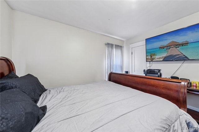 bedroom with wood finished floors