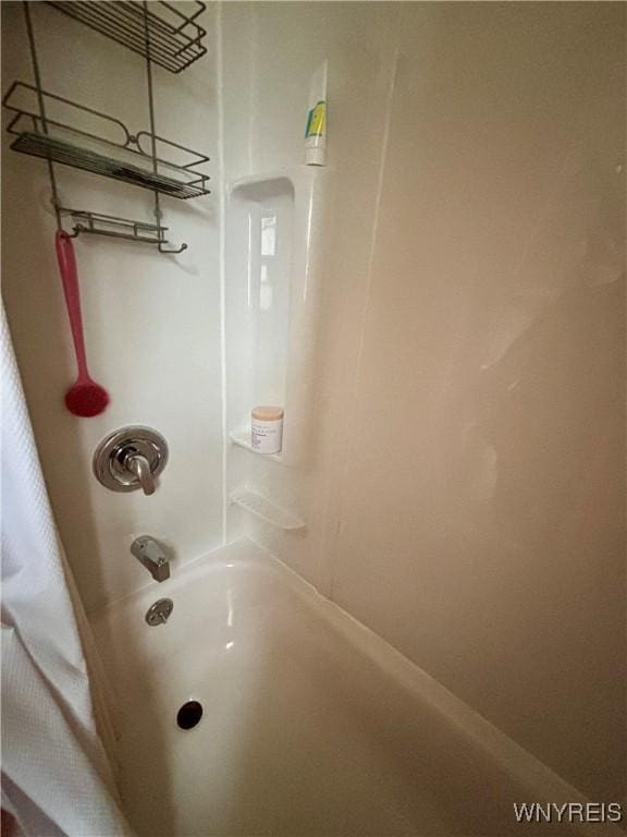 full bathroom featuring shower / tub combo with curtain