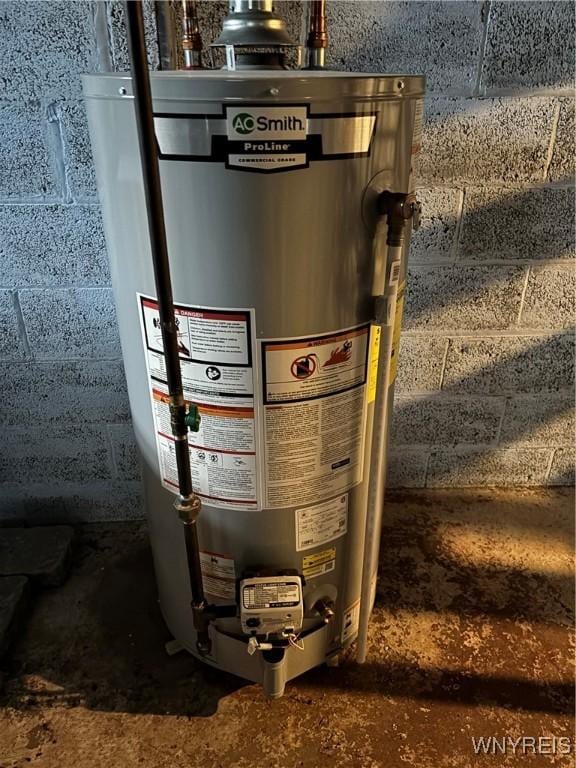 utility room with water heater