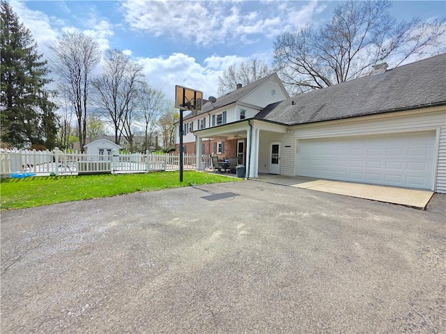 658 Cornell Rd, Elmira-City, NY 14905 - view of side of home with an attached garage, fence, and driveway