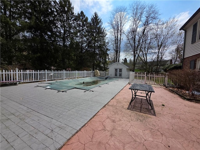 658 Cornell Rd, Elmira-City, NY 14905 - view of pool with an exterior structure, a fenced in pool, an outbuilding, fence, and a patio area