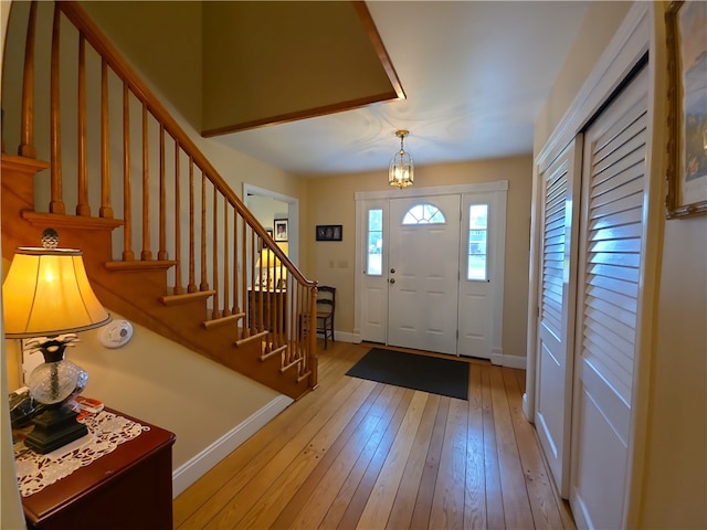 658 Cornell Rd, Elmira-City, NY 14905 - foyer featuring light wood-style floors, stairway, and baseboards
