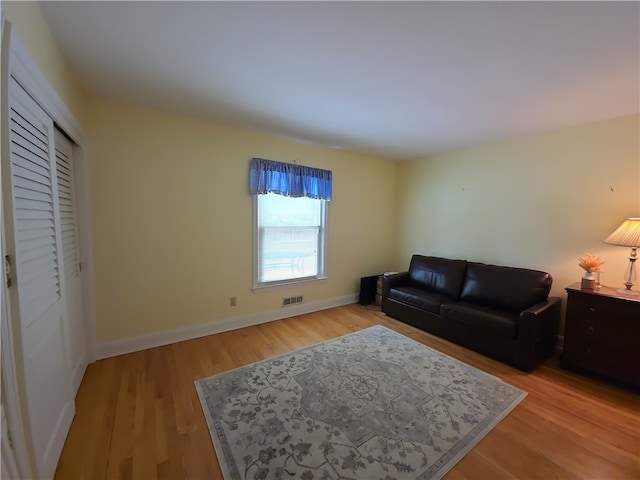 658 Cornell Rd, Elmira-City, NY 14905 - living room featuring light wood-style floors, visible vents, and baseboards