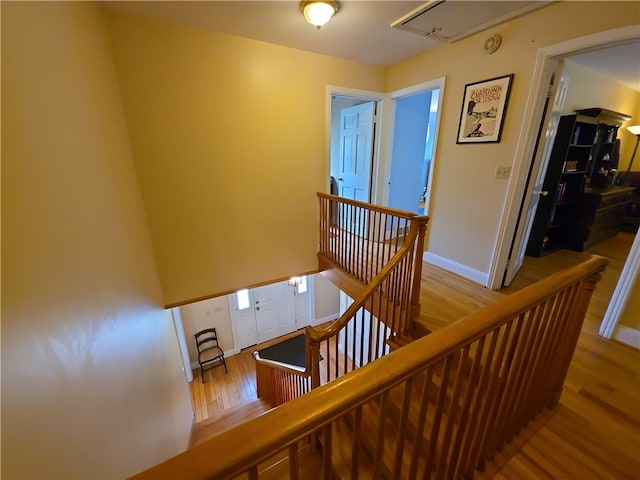 658 Cornell Rd, Elmira-City, NY 14905 - staircase featuring attic access, baseboards, and wood finished floors