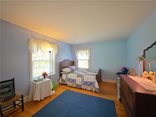 658 Cornell Rd, Elmira-City, NY 14905 - bedroom with baseboards and wood finished floors