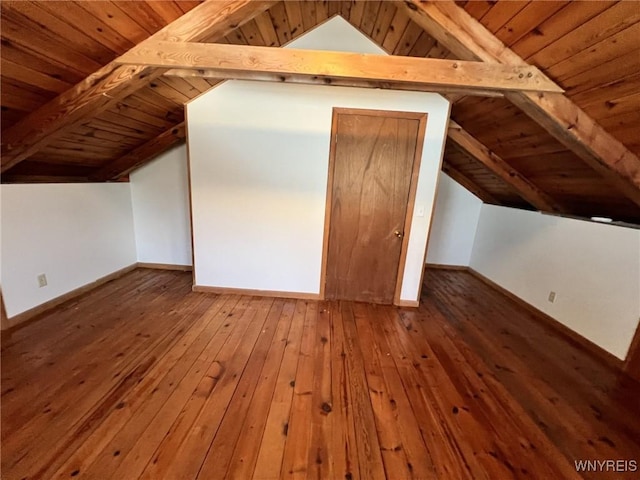 additional living space featuring wood-type flooring, wood ceiling, and lofted ceiling with beams