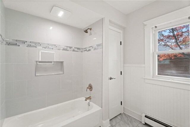 705 W 2nd St, Elmira-City, NY 14905 - bathroom with baseboard heating, wainscoting, bathtub / shower combination, and marble finish floor