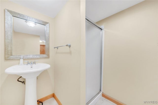 6317 Tonawanda Creek Rd, Lockport-Town, NY 14094 - full bathroom with baseboards, an enclosed shower, and a sink