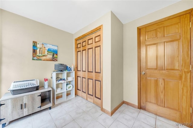 6317 Tonawanda Creek Rd, Lockport-Town, NY 14094 - entryway with baseboards and light tile patterned floors