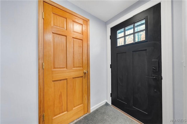 6317 Tonawanda Creek Rd, Lockport-Town, NY 14094 - foyer with dark carpet and baseboards