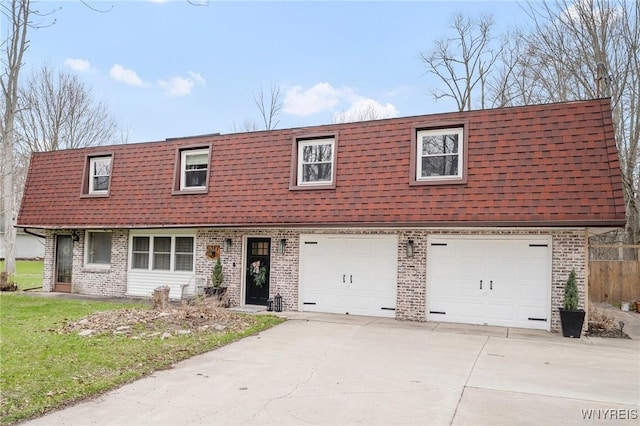 6317 Tonawanda Creek Rd, Lockport-Town, NY 14094 - view of front of house featuring mansard roof, driveway, a garage, brick siding, and a shingled roof