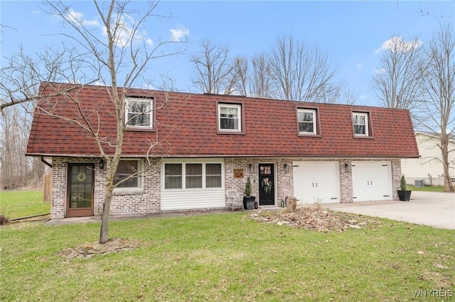 6317 Tonawanda Creek Rd, Lockport-Town, NY 14094 - view of front of home with roof with shingles, mansard roof, driveway, brick siding, and a front yard