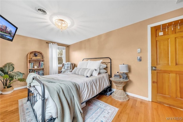 6317 Tonawanda Creek Rd, Lockport-Town, NY 14094 - bedroom with wood finished floors, visible vents, and baseboards