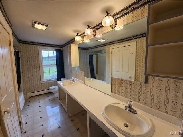 full bathroom featuring a baseboard radiator, a sink, and wallpapered walls