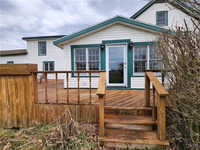 back of house with a wooden deck