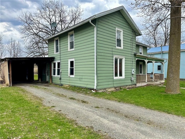65 Union St, Starkey, NY 14837 - view of side of property with driveway, a carport, a yard, and covered porch