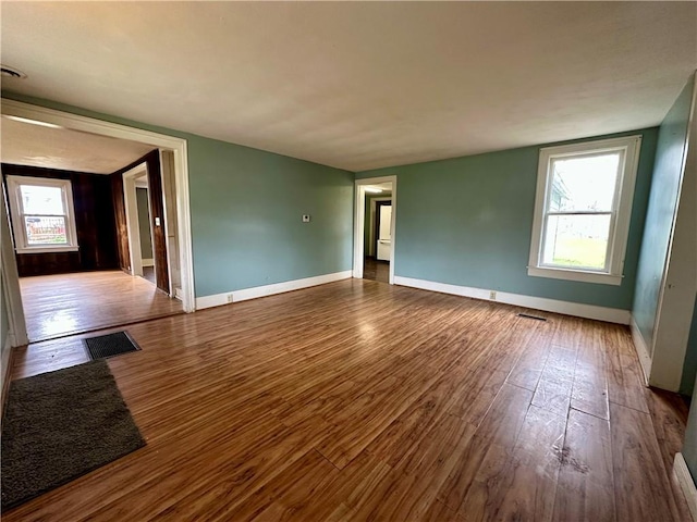 65 Union St, Starkey, NY 14837 - empty room featuring a wealth of natural light, wood finished floors, and baseboards