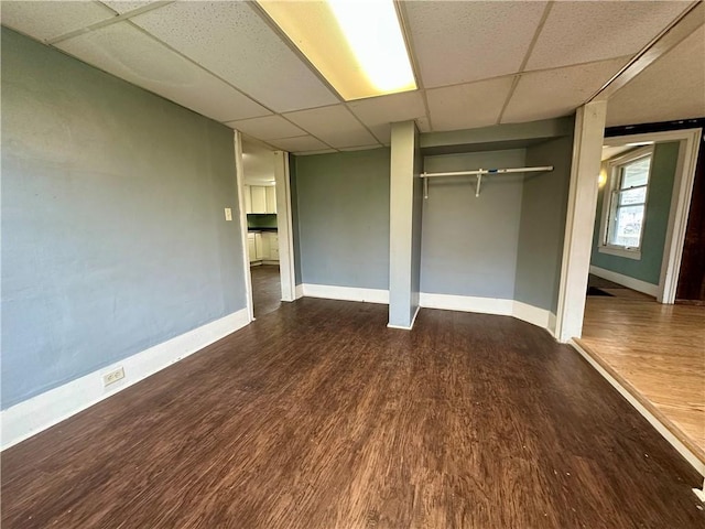 65 Union St, Starkey, NY 14837 - unfurnished bedroom with a paneled ceiling, baseboards, and wood finished floors