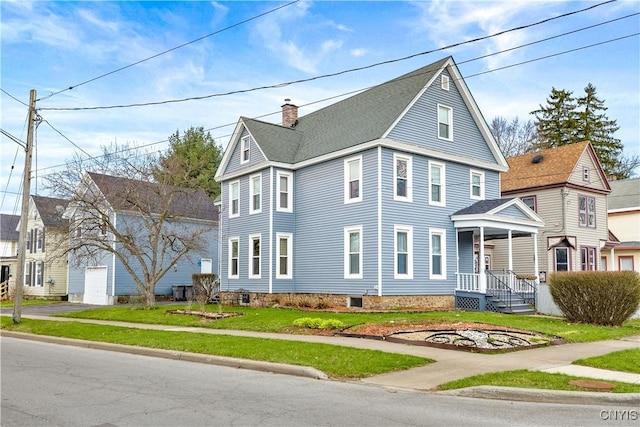 601 W Thomas St, Rome-Inside, NY 13440 - view of front facade with a front lawn and a chimney