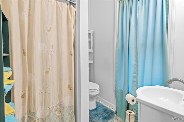 601 W Thomas St, Rome-Inside, NY 13440 - bathroom featuring a shower with shower curtain, toilet, baseboards, and a sink