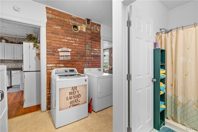 601 W Thomas St, Rome-Inside, NY 13440 - washroom with light tile patterned flooring, washer and dryer, and laundry area