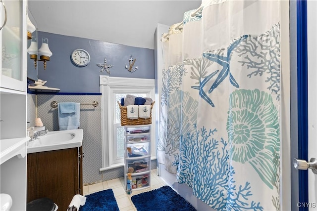 601 W Thomas St, Rome-Inside, NY 13440 - full bath with curtained shower, vanity, and tile patterned flooring