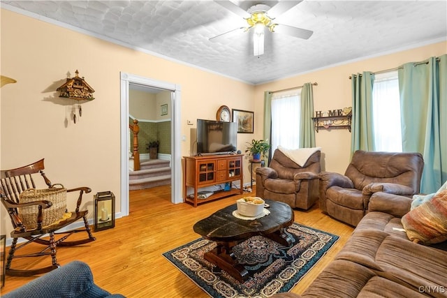 601 W Thomas St, Rome-Inside, NY 13440 - living area featuring a ceiling fan, ornamental molding, and light wood-style flooring