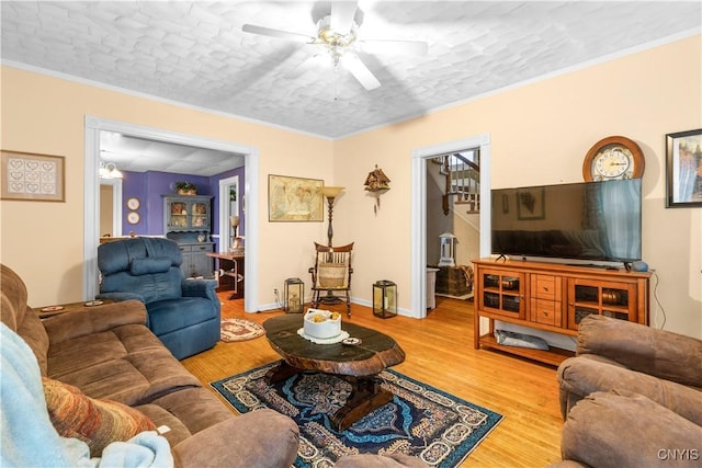 601 W Thomas St, Rome-Inside, NY 13440 - living room featuring light wood-type flooring, a ceiling fan, baseboards, and crown molding