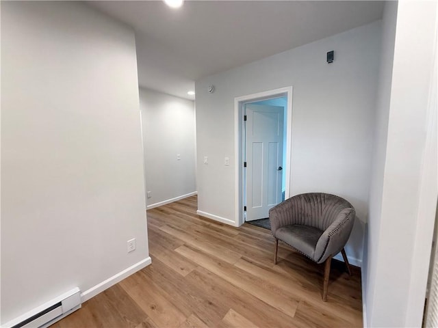 2002 Maes Lndg, Canandaigua-Town, NY 14424 - living area featuring a baseboard heating unit, baseboards, recessed lighting, and light wood-style floors