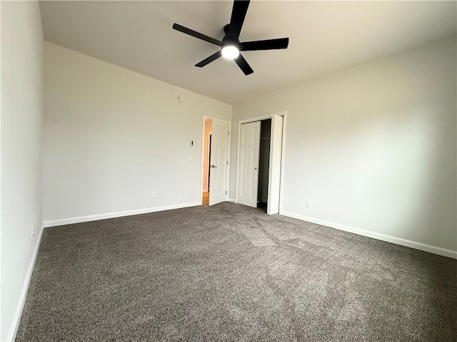 2002 Maes Lndg, Canandaigua-Town, NY 14424 - unfurnished bedroom with dark colored carpet, baseboards, and a closet