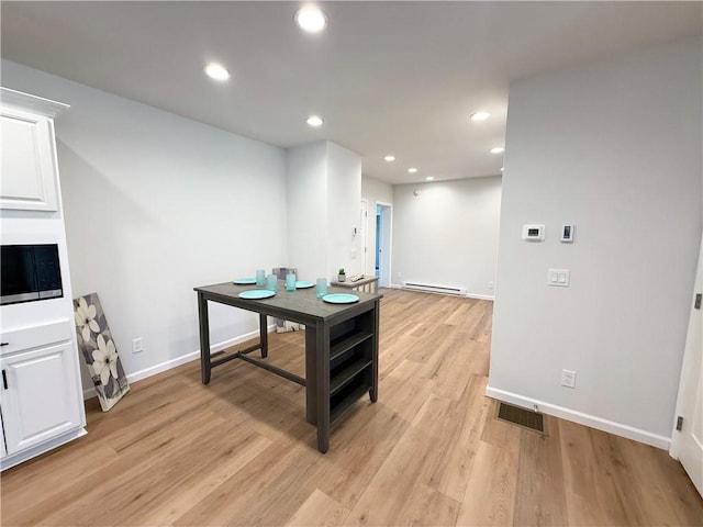 2002 Maes Lndg, Canandaigua-Town, NY 14424 - home office featuring light wood-style floors, baseboards, visible vents, and baseboard heating