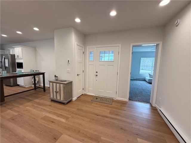 2002 Maes Lndg, Canandaigua-Town, NY 14424 - foyer with baseboards, recessed lighting, light wood-style floors, and a baseboard radiator