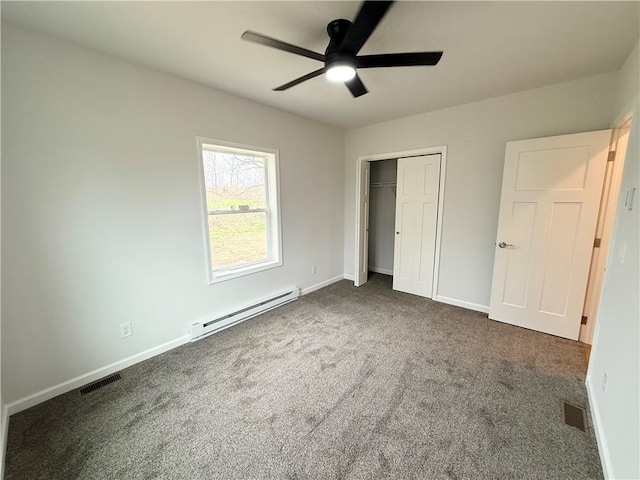 2002 Maes Lndg, Canandaigua-Town, NY 14424 - unfurnished bedroom featuring visible vents, baseboards, a closet, carpet floors, and a baseboard radiator