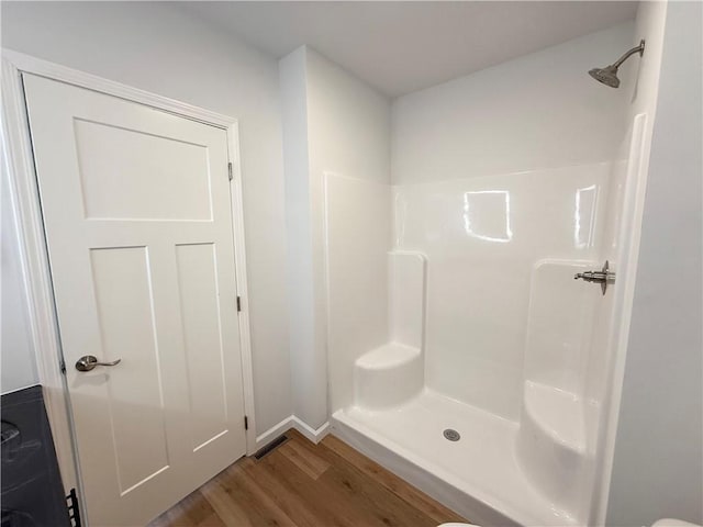 2002 Maes Lndg, Canandaigua-Town, NY 14424 - bathroom with baseboards, visible vents, wood finished floors, and a shower