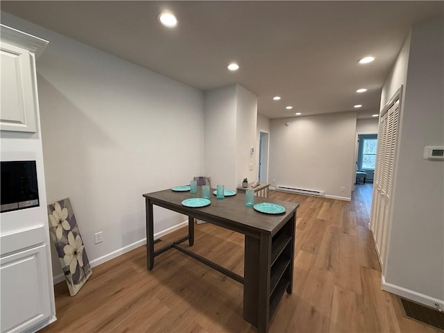 2002 Maes Lndg, Canandaigua-Town, NY 14424 - interior space with a baseboard heating unit, light wood finished floors, baseboards, visible vents, and recessed lighting