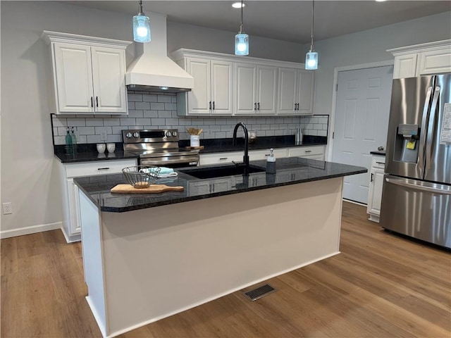 2002 Maes Lndg, Canandaigua-Town, NY 14424 - kitchen with white cabinets, stainless steel appliances, a sink, tasteful backsplash, and premium range hood