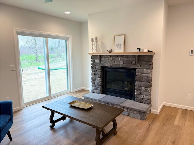 2002 Maes Lndg, Canandaigua-Town, NY 14424 - living area featuring baseboards, wood finished floors, and a fireplace