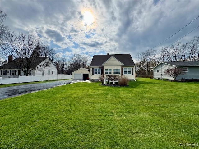 1432 Quaker Rd, Somerset, NY 14012 - view of front of property with an outdoor structure, fence, a front yard, and a garage