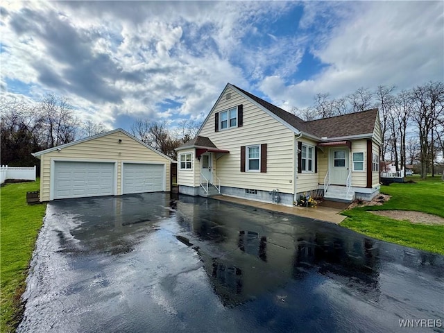 1432 Quaker Rd, Somerset, NY 14012 - bungalow-style house featuring a shingled roof, an outdoor structure, and a detached garage