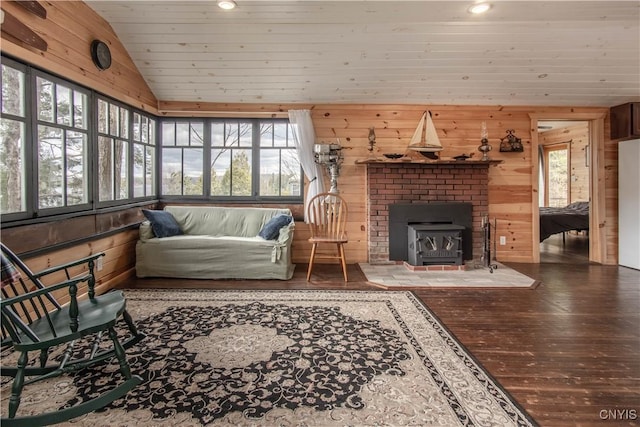 living area with recessed lighting, lofted ceiling, wood walls, and hardwood / wood-style flooring