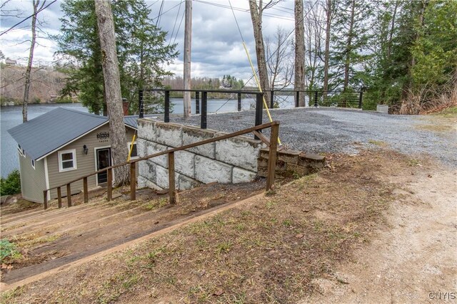exterior space with a water view