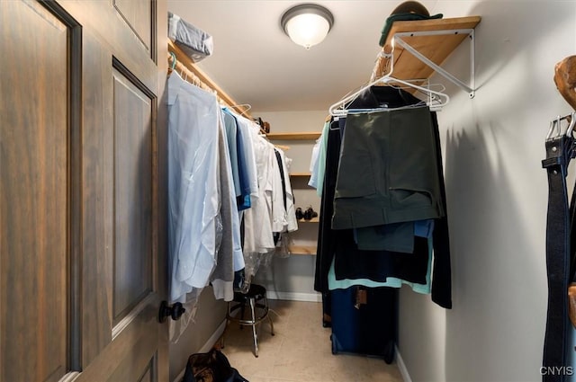 walk in closet featuring light tile patterned floors