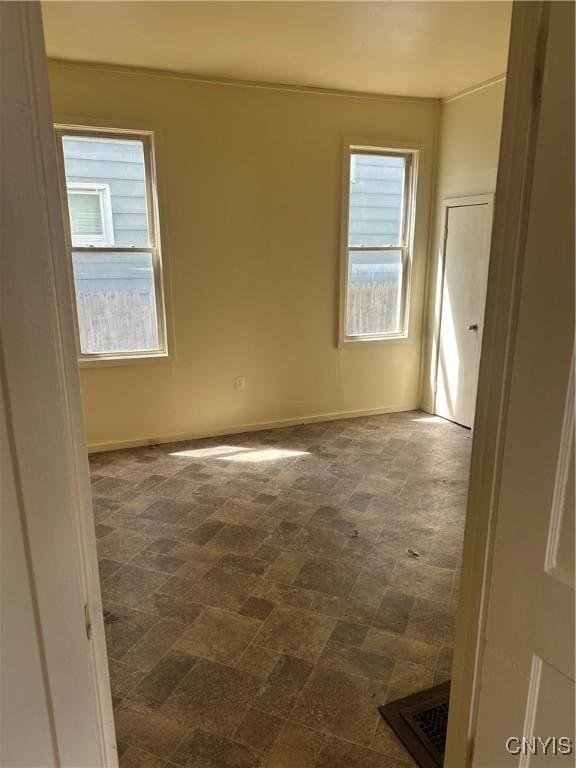 empty room with baseboards