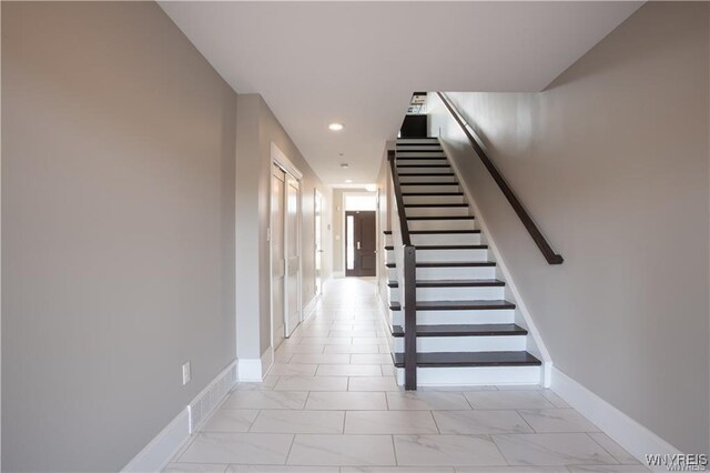 35 Ojibwa Cir, Buffalo, NY 14202 - stairway with marble finish floor, baseboards, and recessed lighting