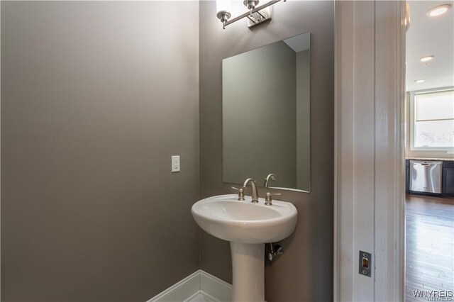 35 Ojibwa Cir, Buffalo, NY 14202 - bathroom with baseboards and wood finished floors