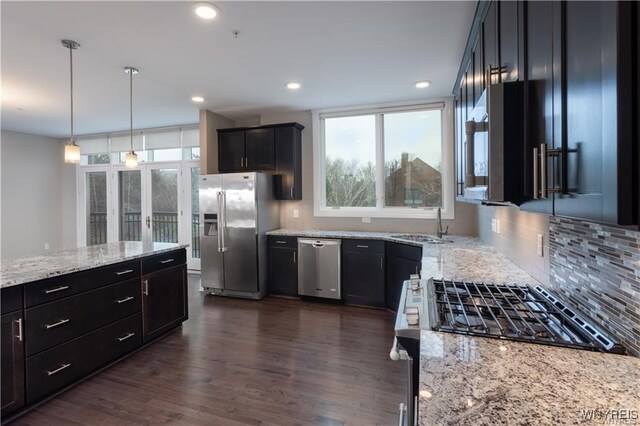 35 Ojibwa Cir, Buffalo, NY 14202 - kitchen featuring stainless steel appliances, a sink, a wealth of natural light, tasteful backsplash, and light stone countertops