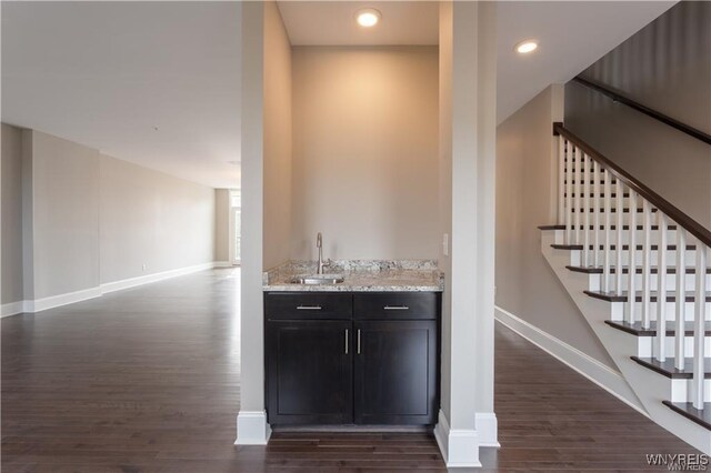 35 Ojibwa Cir, Buffalo, NY 14202 - bar featuring a sink, dark wood-style flooring, baseboards, stairs, and indoor wet bar